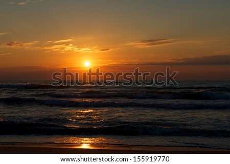 Beautiful sunset above the sea, multicolored sunset, dramatic background, Sunset on the Beach with beautiful colorful dramatic sky and sun reflection in sunset, Baltic sea. Dramatic sunset.Saturate.