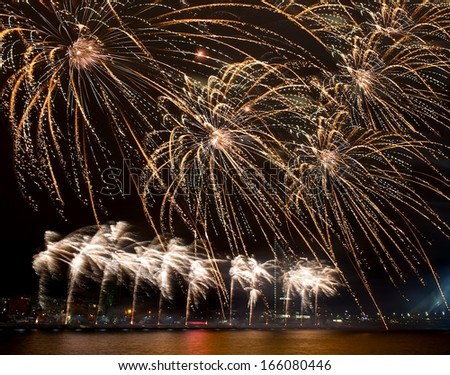 Fireworks,colorful fireworks background,fireworks explosion in dark sky with city siloutthe on bottom,fireworks in Riga, Latvia,long exposure of fireworks,Independence day,explode concept