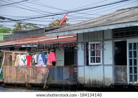 Poor life in Thailand, poor houses in Asia, asian houses on water, still life photography, social issue, asian house exterior, typical asian house, poor district in Bangkok