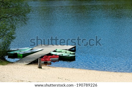 Empty boats waiting season on sunny day, summer, boats in the water, camping area in sunny day, Lithuania, summer activities, sport, empty boats