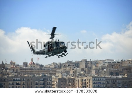 Helicopter in the sky in Valletta city, air transport with city background, conceptual photo, Malta, army day in Malta, one plane in sky, Valletta, Europe, Malta, security in Malta, army transport