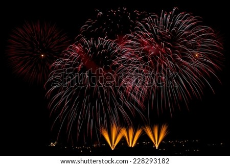 Fireworks. Colorful different colors, amazing fireworks in Malta, dark sky background and house light in the far, Malta fireworks festival, 4 of July, Independence day, New Year
