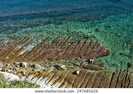 Maltese coastline with emerald sea water and rocks in a water, clear sea in Malta, social issue environment photo, clear sea and stones in water, crystal coast