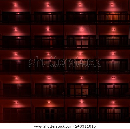 Red light windows, red lighting, city urban photo, architectural fragment, red light, red windows, exterior fragment, windows
