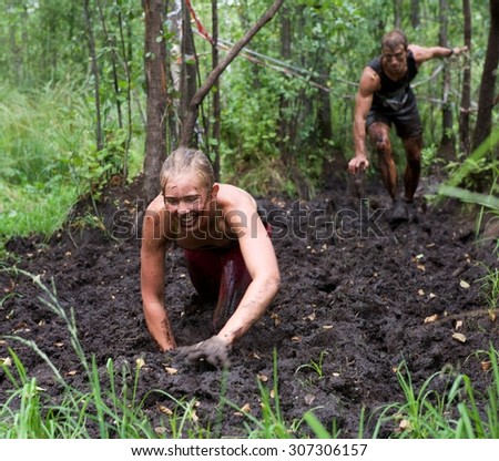 Sirvintos, Lithuania - Aug 9: Beaver run or Lithuanian version of best known as Tough Mudder in Sirvintos district in Lithuania on Aug 9, 2015. Summer sport and leisure activities  in Lithuania