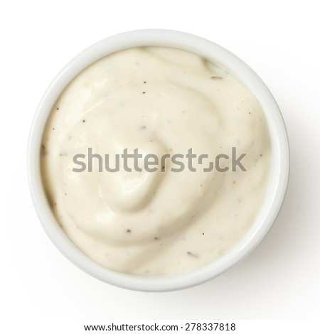 Small pot of garlic mayonnaise, isolated, detail, from above.