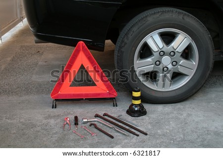 early warning device with tire changing tools
