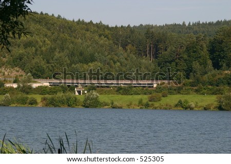 ICE train racing through a german landscape