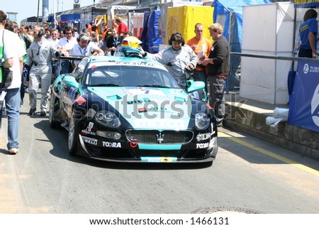 Car and people at the 24h race at the Nuerburgring, Germany