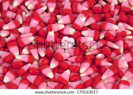 Valentine\'s candy corn with a candy heart.