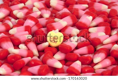 Valentine\'s candy corn with a candy heart.