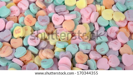 A bunch of colorful Valentine\'s candy hearts.