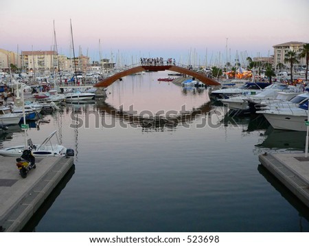 Bridge and boats in French Riviera. French Riviera a very popular tourist attraction - Saint Tropez Gulf, Cote d\'Azur, France