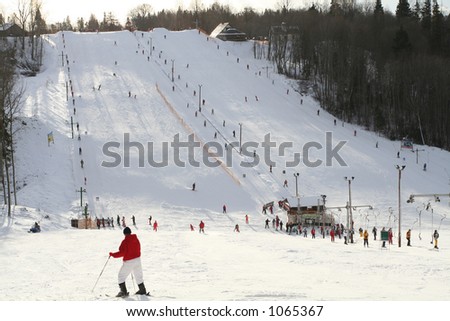 Skiers on hill