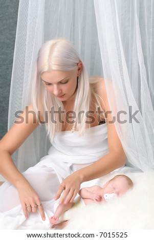 White family - mother takes care about angel like child