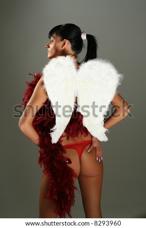 Fallen angel - passionated model with wings in red underwear