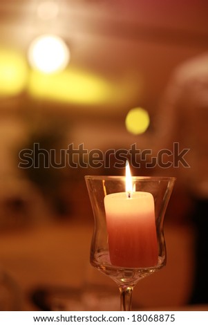 Romantic and mysterios scene - candlelight in glass