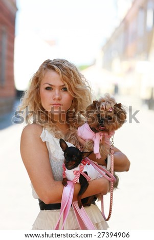 Fashion - girl and two of her little friends, small cute dogs
