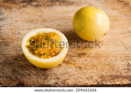 Passion fruits on wooden background.