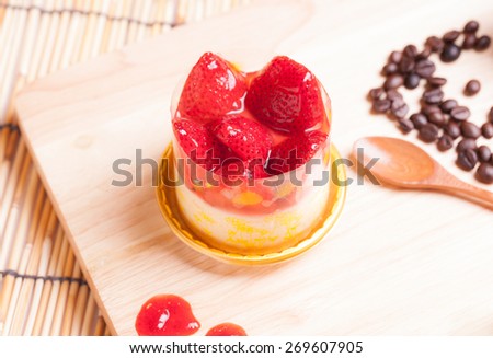 strawberry cheese cake on wood.