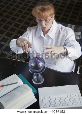 A business woman, or a student, is consulting her crystal ball.