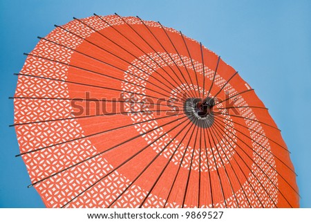 A decorative umbrella characteristic of various Asian cultures.