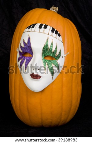 A pumpkin wearing a mask.