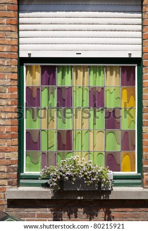 Stained glass window with flower box.