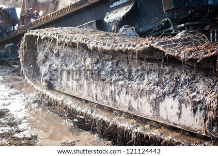 Detail of caterpillar track in construction site