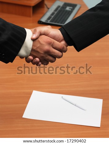 Successful deal concept - handshake closeup photo.