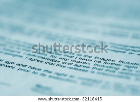 Macro shot of a printed text in blue tint
