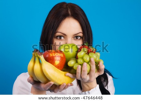 Beautiful young girl with a bunch of fruits, with \