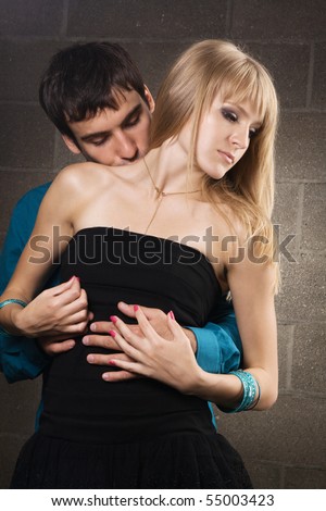 young couple kissing in the rain. stock photo : Young romantic