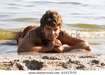 Handsome man relax on the seashore
