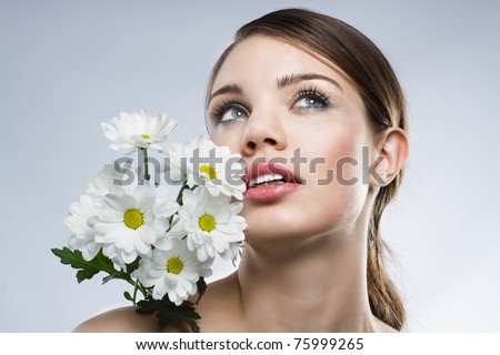 Face portrait of a beautiful woman, neutral background
