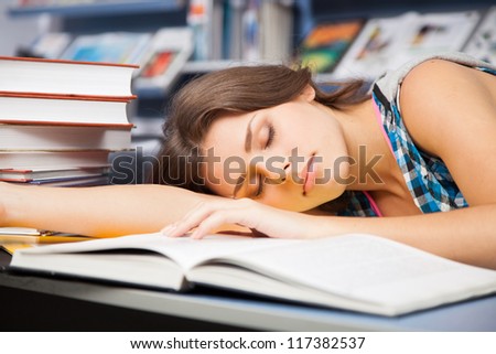 Beautiful female student in a university library