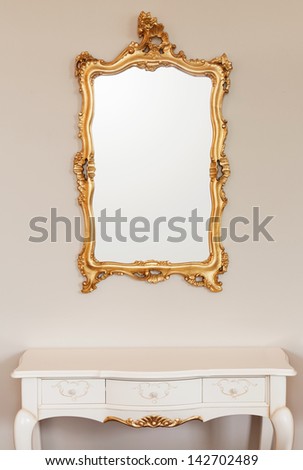 Golden Mirror Frame On The Wall