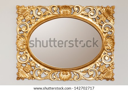 Golden Mirror Frame On The Wall