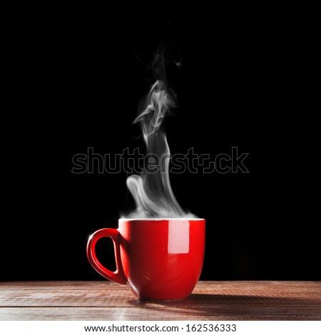Steaming Coffee Cup On Dark Background