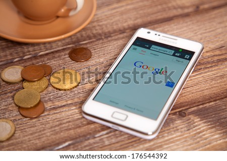 Wroclaw, Poland - January 10, 2014: Photo Of Samsung Galaxy S Ii Device With Google.Com Homepage On Its Screen