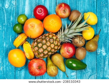 Set of colorful fruits on old wood background