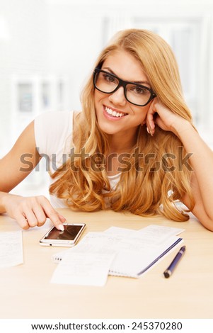 Young woman doing her accounts