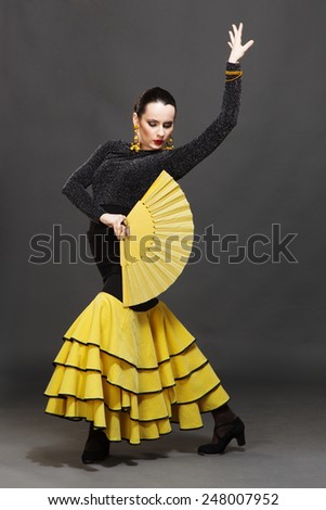 Flamenco dancer in a yellow skirt