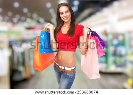 Beautiful lady with shopping bags, isolated on white background