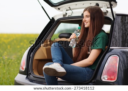 Young woman on a road trip.