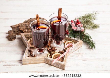 Mulled wine with cinnamon sticks and orange