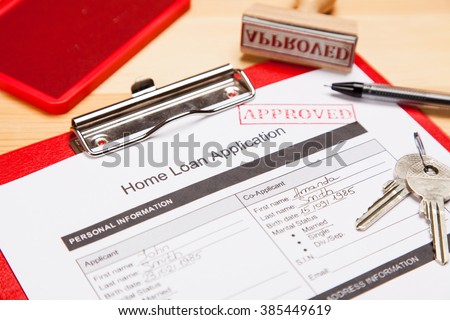 Approved home loan application form close-up photo