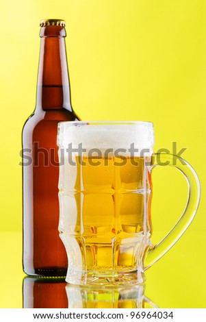 Beer mug and bottle isolated on white background, studio photo