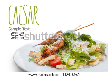 Caesar Salad with Chicken isolated on white. Easy removable text.