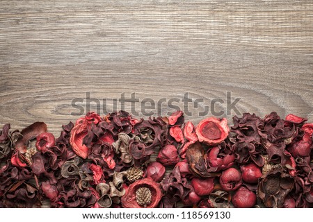 Potpourri. Close-up of dried flowers, used for aromatherapy, over wooden background. Top view.